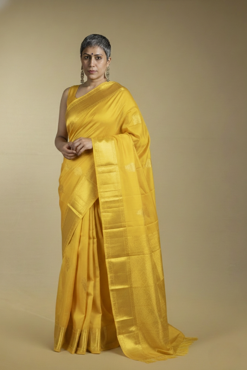Manjal - Yellow and Gold Kanjivaram silk saree. With Gold Zari border and Pallu