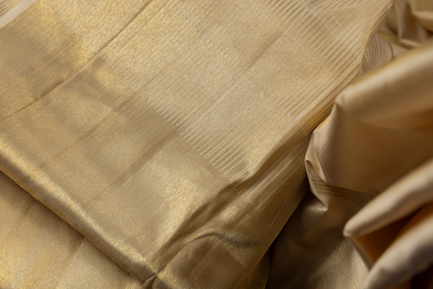 Gold and cream Kanjivaram saree with gold zari pallu