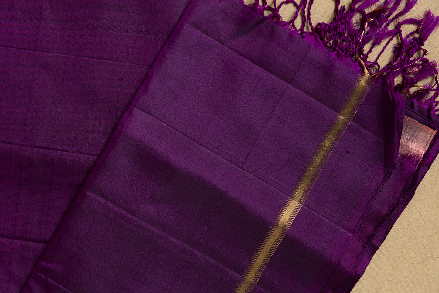 Purple Kanjivaram saree with thin gold zari border