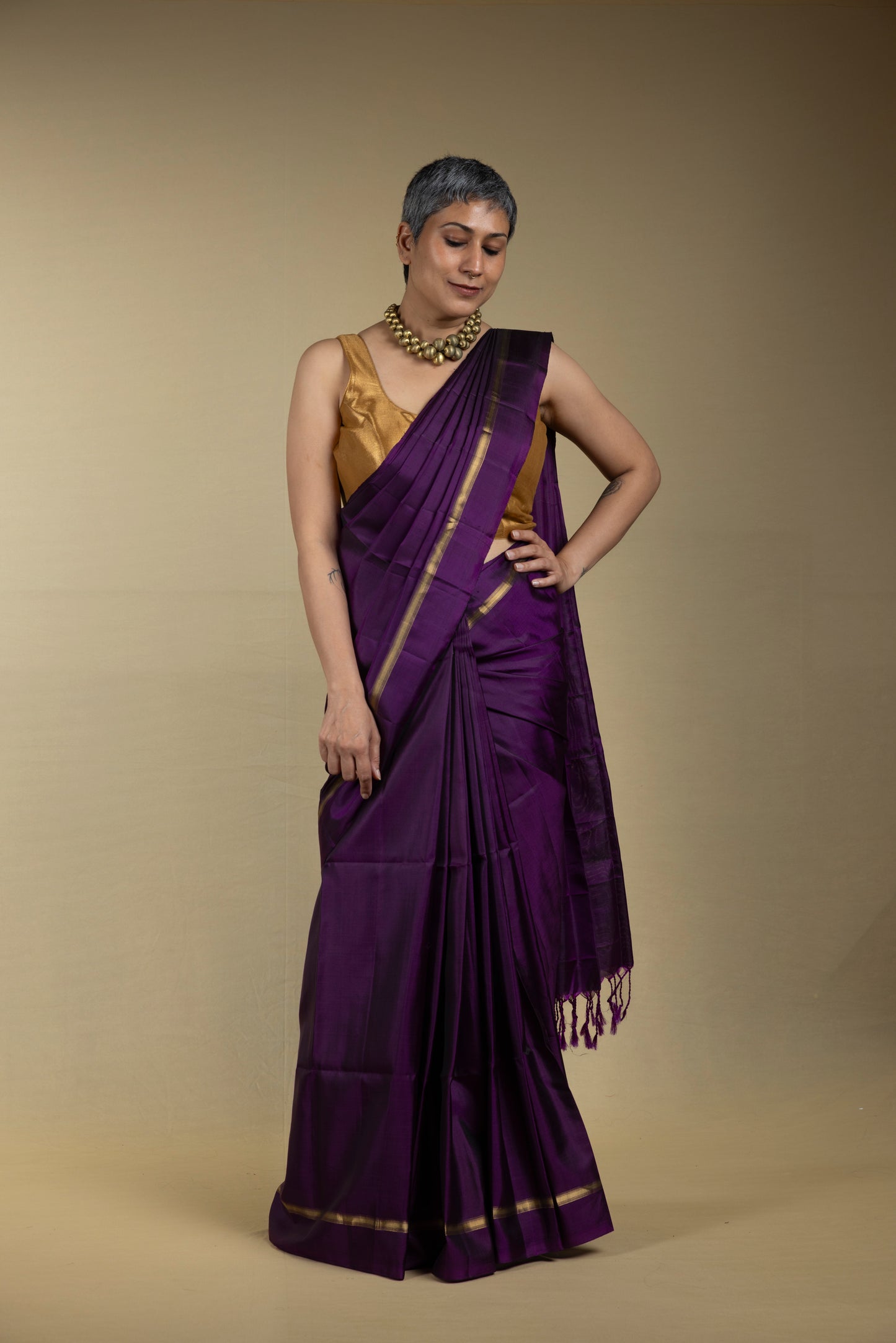 Purple Kanjivaram saree with thin gold zari border