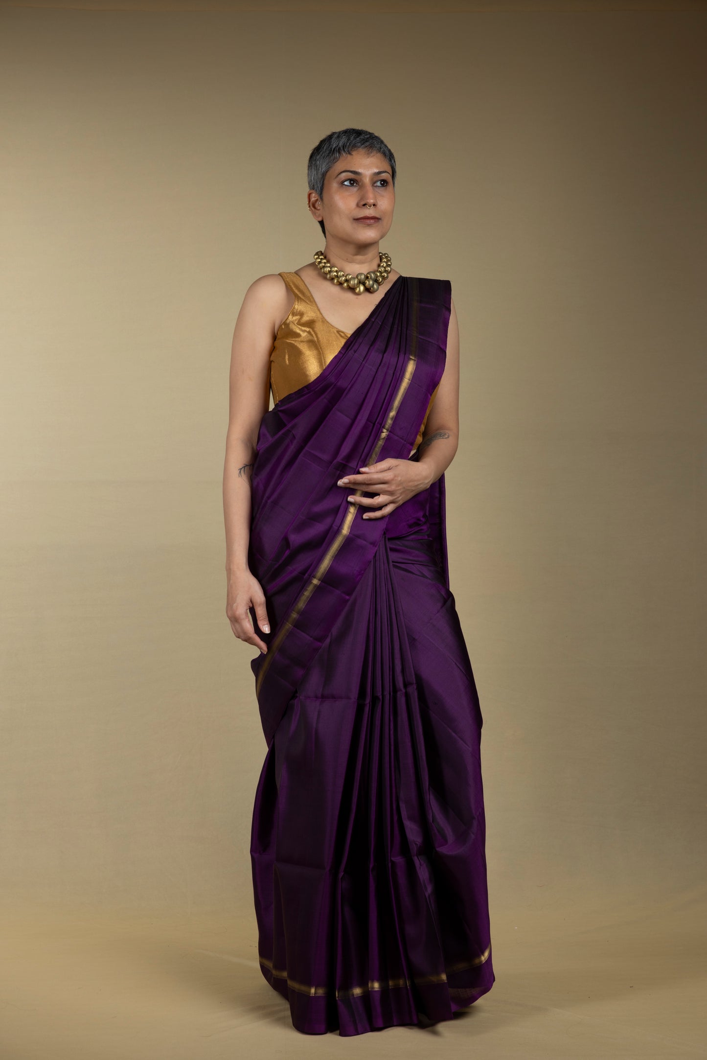 Purple Kanjivaram saree with thin gold zari border