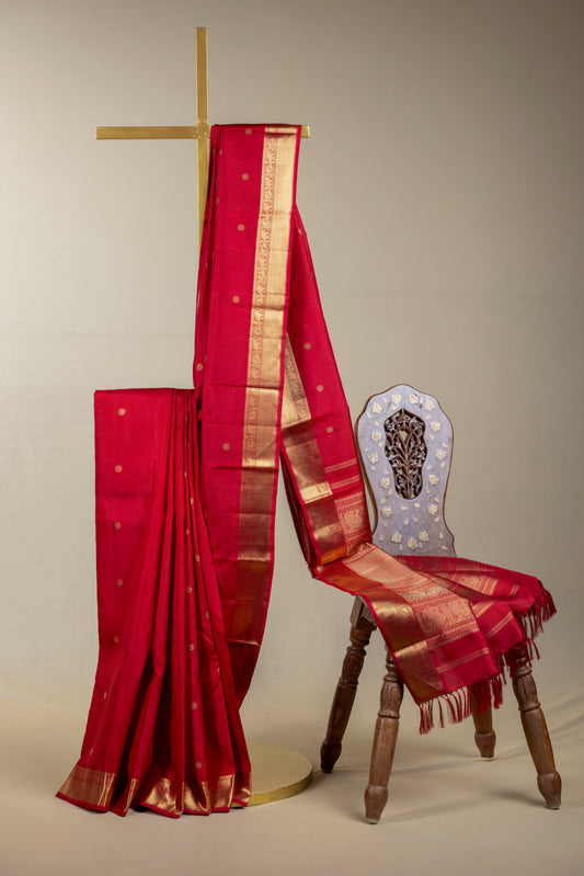 Tomato red Kanjivaram saree with gold border