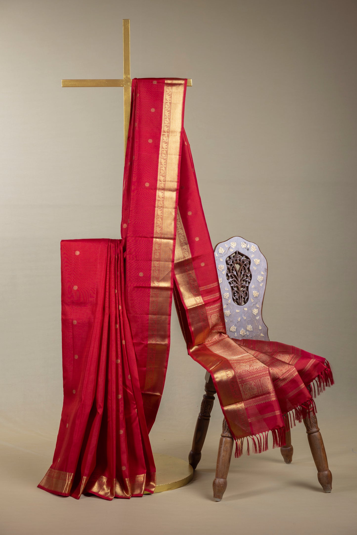 Tomato red Kanjivaram saree with gold border