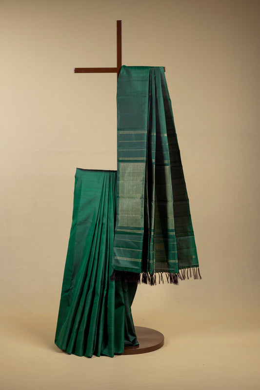 Green Kanjivaram saree with gold pin stripes