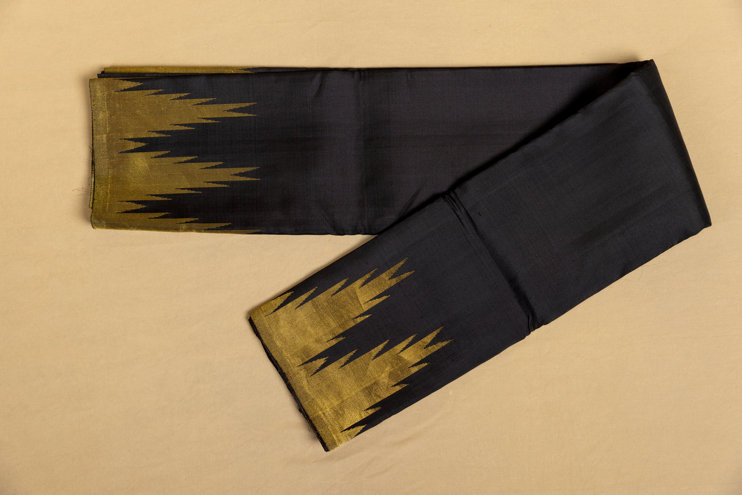 Black and gold Kanjivaram saree with gold temple border