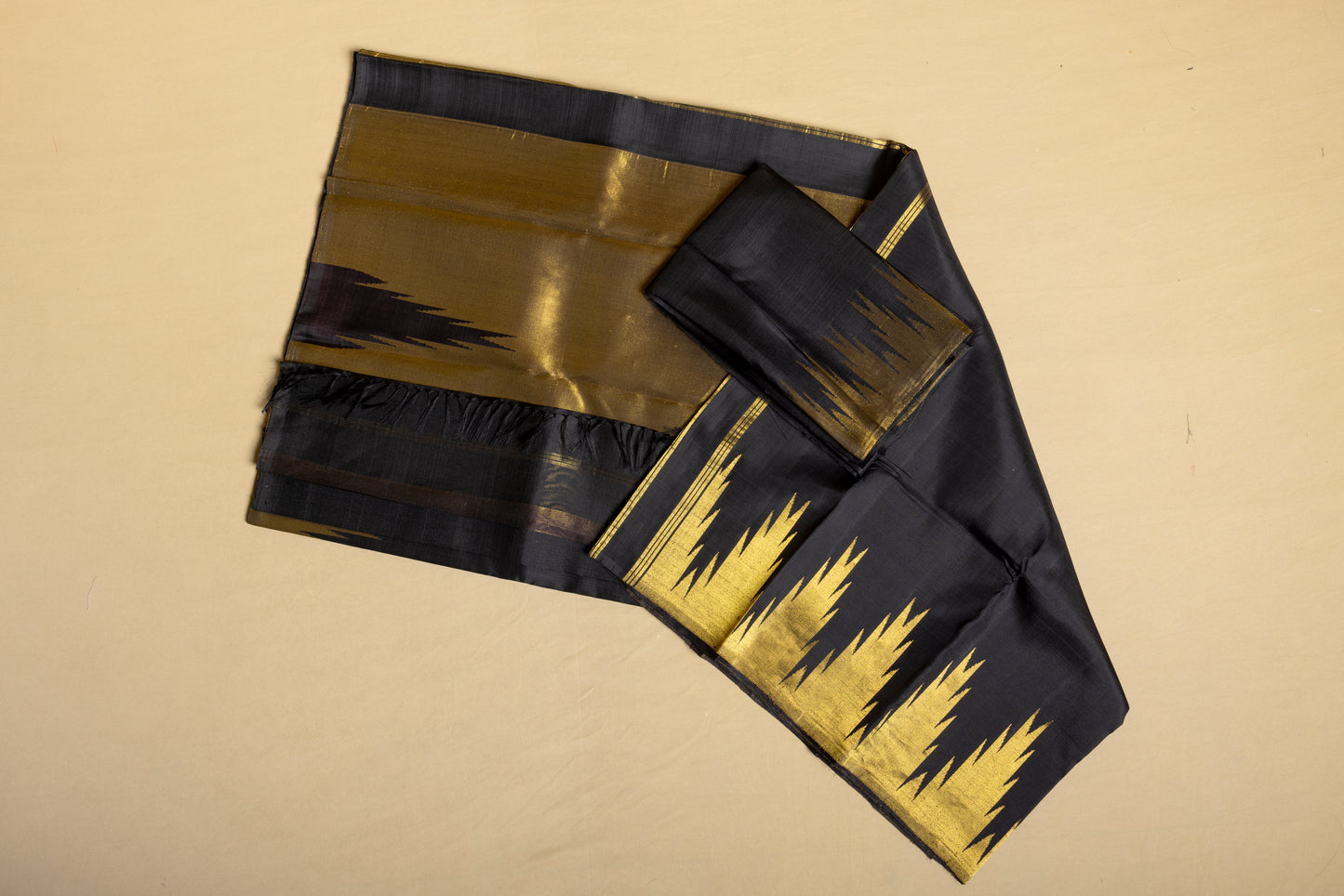 Black and gold Kanjivaram saree with gold temple border