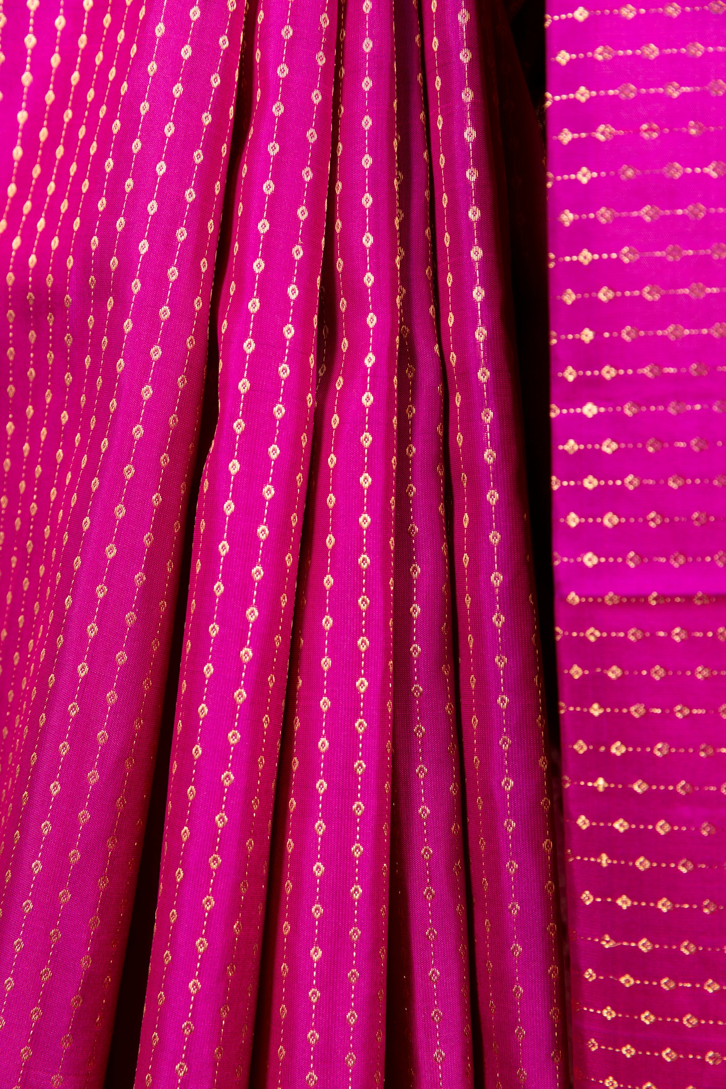 Magenta Kanjivaram saree with gold pin stripes and gold pallu