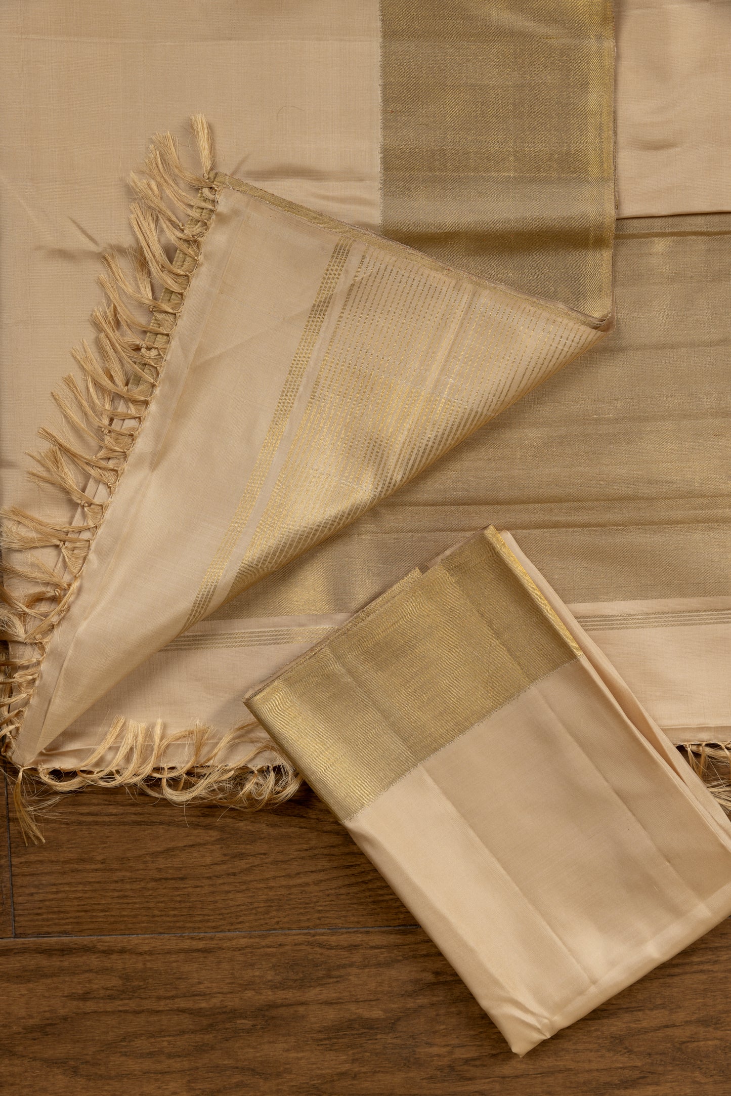 Gold and cream Kanjivaram saree with gold zari pallu