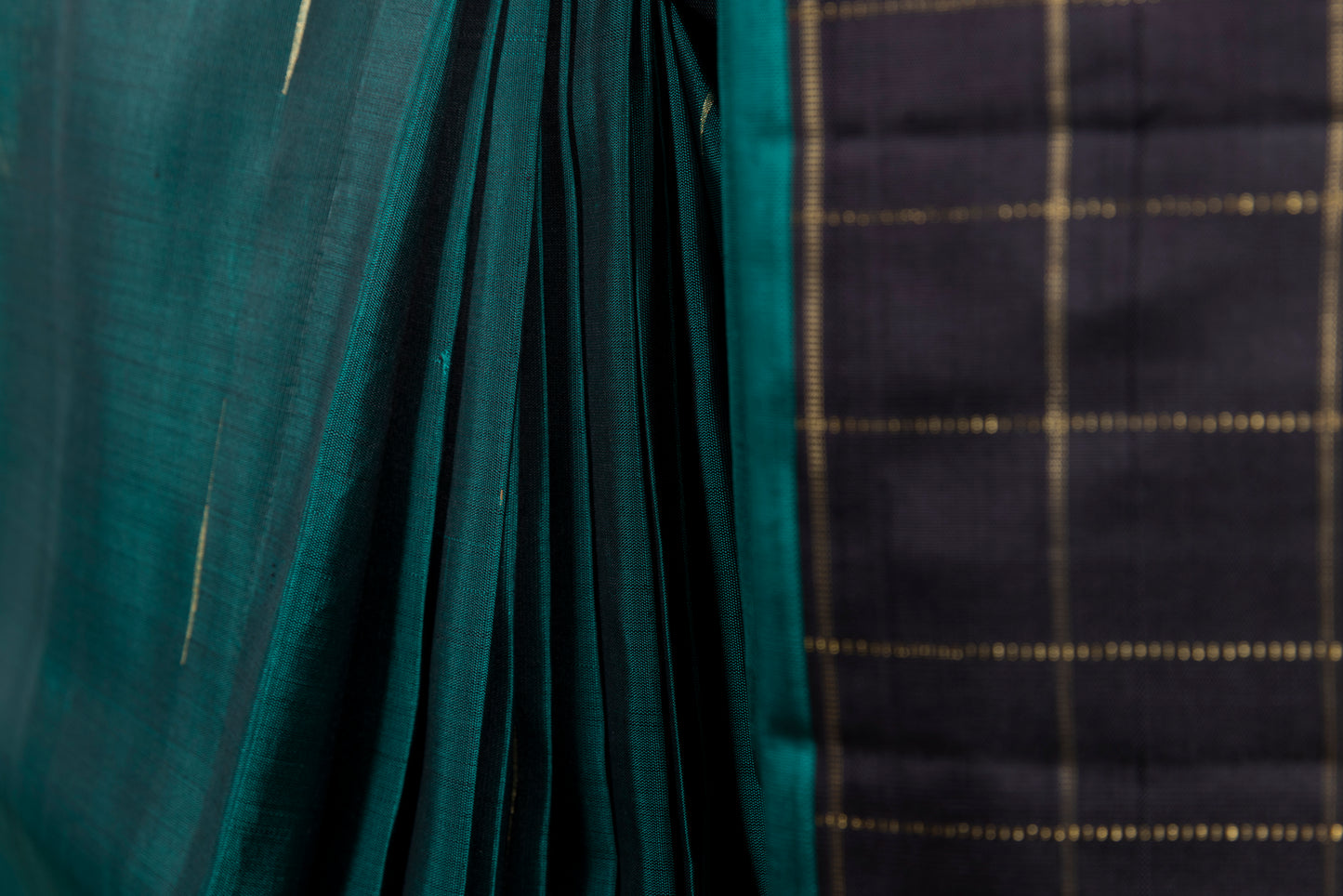 Black and green Kanjivaram saree with gold checks