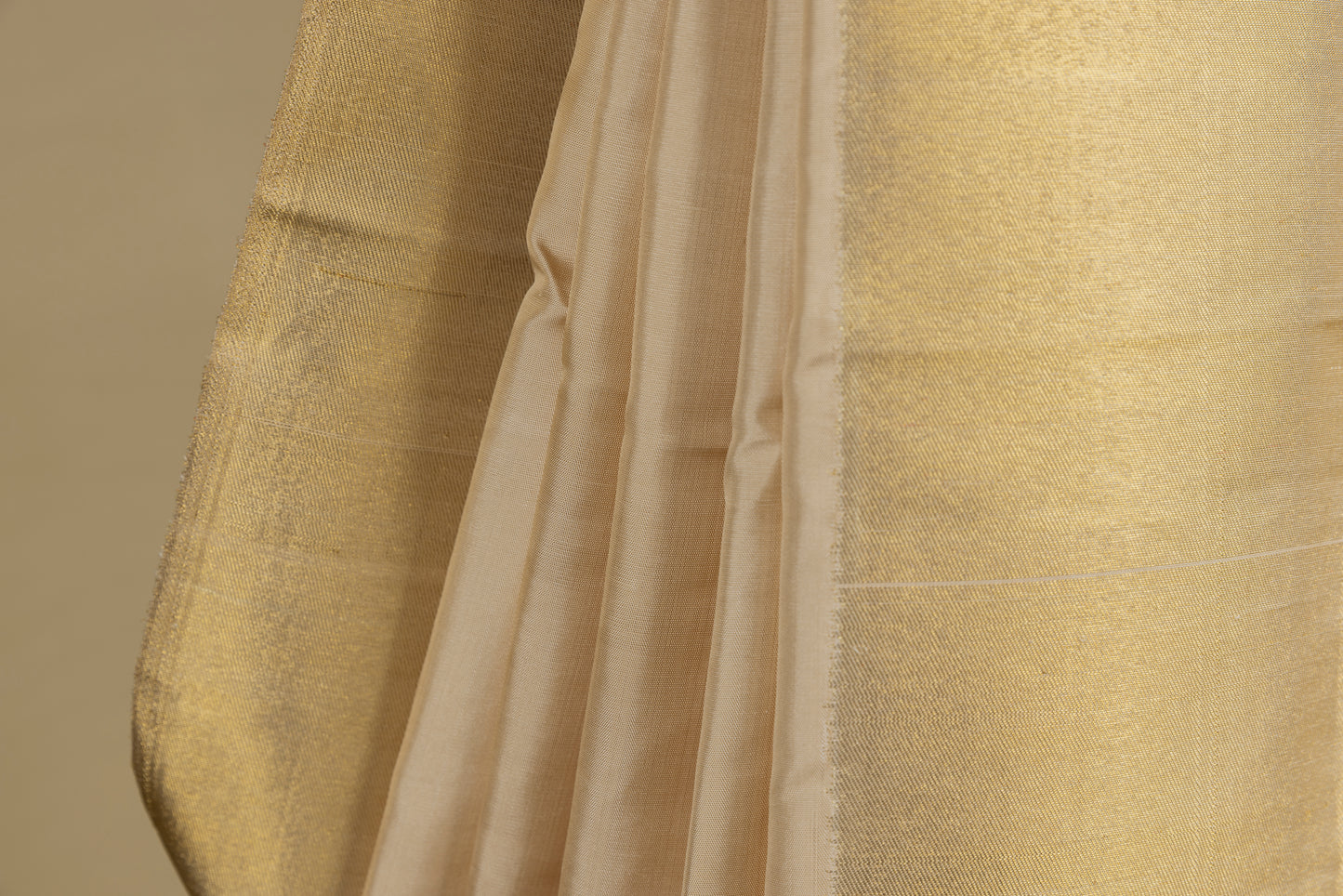 Gold and cream Kanjivaram saree with gold zari pallu