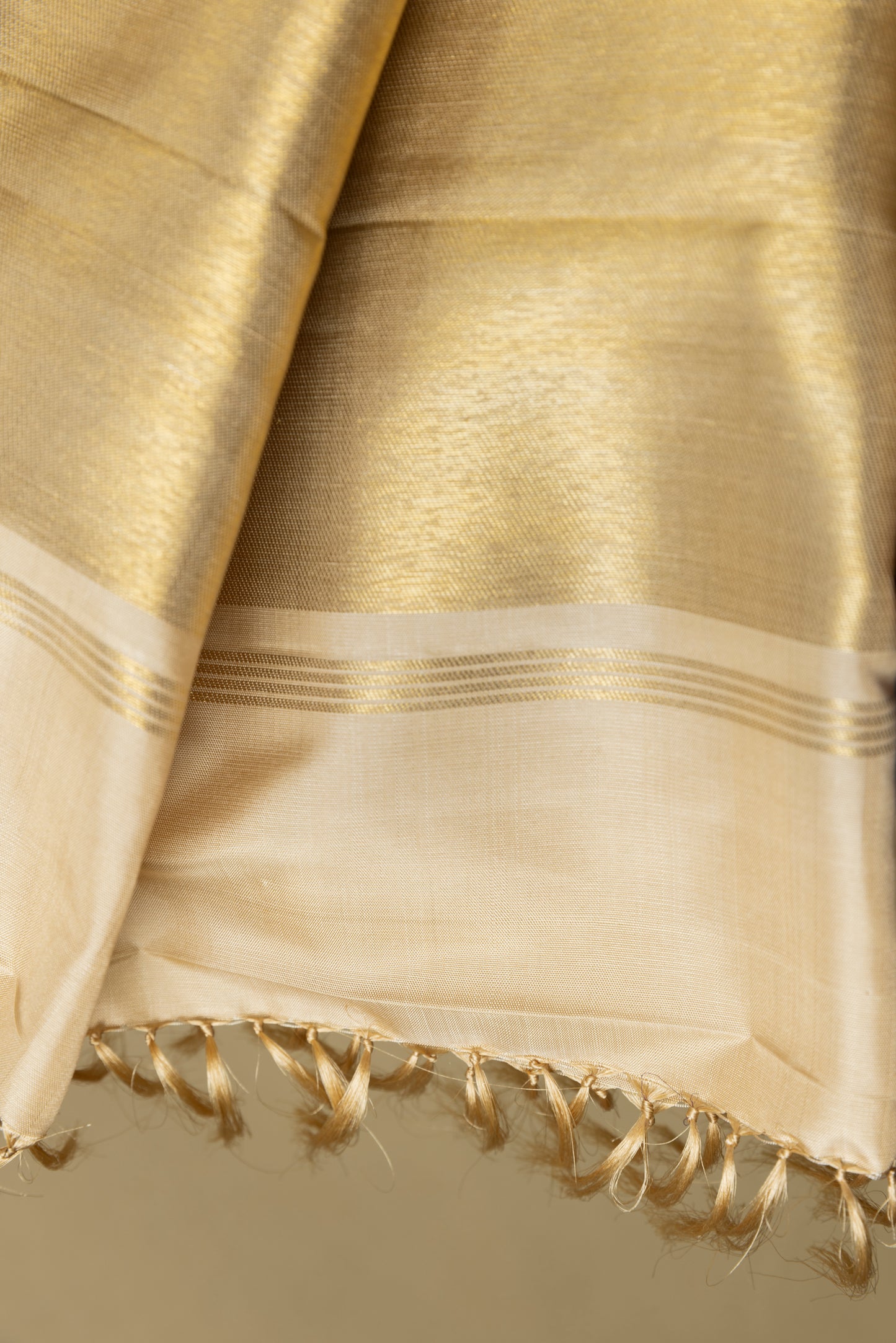 Gold and cream Kanjivaram saree with gold zari pallu