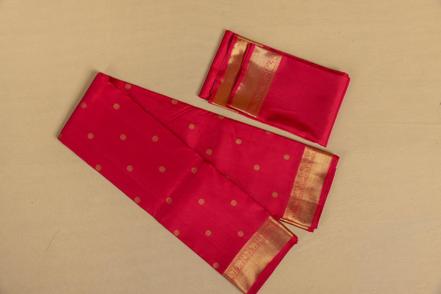 Tomato red Kanjivaram saree with gold border